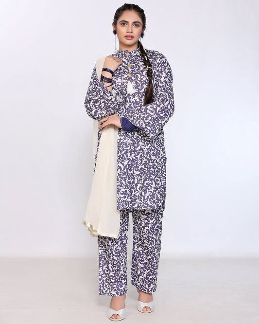 Woman wearing a floral patterned outfit with a white background